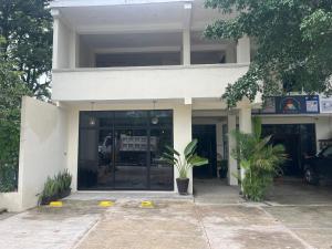 a building with a fire truck inside of it at Hotel Rio Maya in Palenque +26 photos