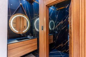 a bathroom with a sink and a mirror at Modern Luxury Villa Heart of Central agadir in Agadir