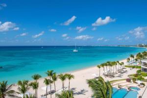 an aerial view of a beach with palm trees and the ocean at Beachcomber 35 in George Town