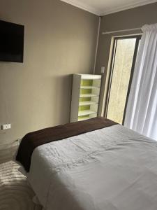Postel nebo postele na pokoji v ubytování Room in Cimbebasia