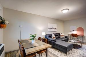 a living room with a couch and a table at Parking Pets Private Entrance Near Med Center in West Allis +17 photos