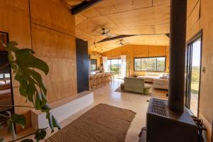 a living room and kitchen in a house at Ocean View Escape in Sandy Beach