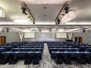 a room with blue tables and chairs in it at Novotel Ambassador Seoul Gangnam in Seoul +98 photos
