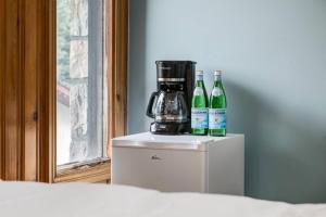 two bottles of wine sitting on top of a refrigerator at Gateway Suites Cozy stay to explore Banff and Canmore in Canmore