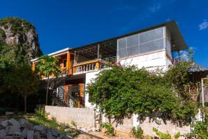 a house on the side of a mountain at Phong Nha Family Homestay in Phong Nha