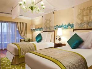 Кровать или кровати в номере Sofitel Legend Old Cataract