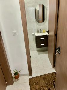 a bathroom with a sink and a mirror at LUXES Studio in Dakar +11 photos