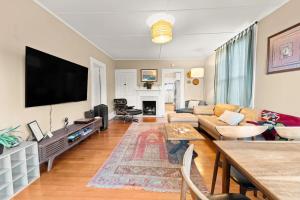 a living room with a large flat screen tv at Sea View, Sauna, Hot Tub, Beach Bikes, Stream in Ventura