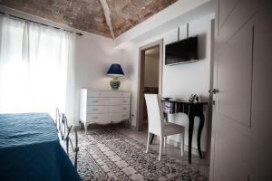 Postel nebo postele na pokoji v ubytování Palazzo Pagliaro
