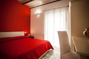 Postel nebo postele na pokoji v ubytování Palazzo Pagliaro