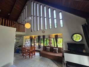 a living room with a couch and a table at MIRZ Accomodation Villa 2 in Pacific Harbour