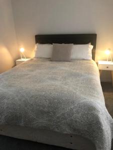 Ένα ή περισσότερα κρεβάτια σε δωμάτιο στο South Bay Rest