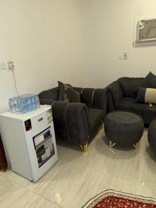 a living room with a couch and a table at أحد 2 in Al Madinah