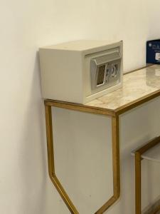 a microwave sitting on top of a counter at أحد 2 in Al Madinah +39 photos