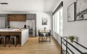 a kitchen with a counter and a table with chairs at Riot - Private Patios - Heart of Old Town in Scottsdale