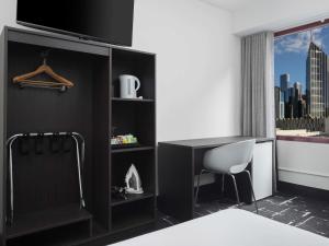 Кровать или кровати в номере Mercure Welcome Melbourne