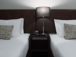 Кровать или кровати в номере Mercure Welcome Melbourne +26 фотографий
