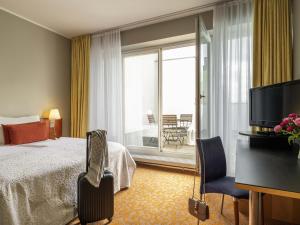 Postel nebo postele na pokoji v ubytování Mercure Hotel & Residenz Berlin Checkpoint Charlie + 111 fotografií