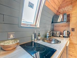 a kitchen with a sink and a counter top at Boxing Hare - Uk39915 in Heckington +7 photos