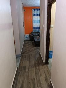 a hallway of a room with a wooden floor at Mango Plaza in Homa Bay