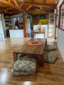 a wooden table and a bench in a room at Casa Principal in Itapeva +23 photos