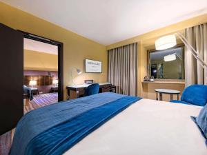 Кровать или кровати в номере Mercure Gdańsk Stare Miasto