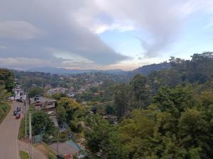 a view of a city with trees and a road at Magnola Hotels in Bandarawela +14 photos