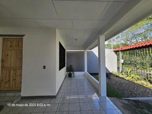 a hallway of a house with a door at Casa Burbujas in Puerto Jiménez