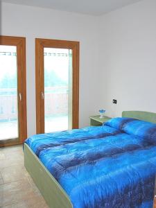 Un pat sau paturi într-o cameră la Pizzo Camino