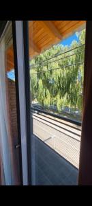 プロッティエルにあるComplejo Boulevard Plottierの列車窓からの眺め +28枚の写真
