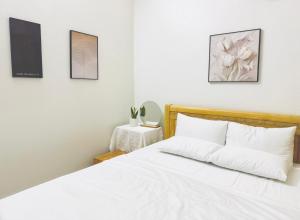 Ένα ή περισσότερα κρεβάτια σε δωμάτιο στο Chichi Inn Hotel CoTo +29 φωτογραφίες