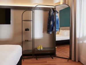 Кровать или кровати в номере Ibis Madrid Aeropuerto Barajas