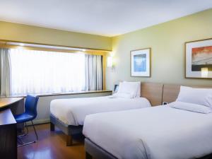 Katil atau katil-katil dalam bilik di Novotel Santiago Vitacura