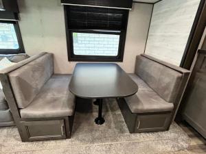 a table and two chairs in an rv at Comfortable 1BR RV for mid-to-long term stays in Beaumont