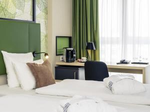 Postel nebo postele na pokoji v ubytování Mercure Hotel Hannover Mitte