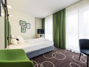 Postel nebo postele na pokoji v ubytování Mercure Hotel Hannover Mitte