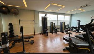 a gym with several treadmills and machines in a room at Wise SP Expo Center e Anhembi in São Paulo