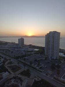 an aerial view of a city with the ocean and buildings at Hermoso y acogedor departamento, excelente ubicación! in Coquimbo
