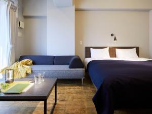 Una cama o camas en una habitación de Minn Juso