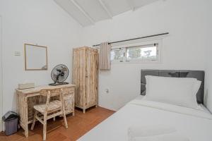 Ένα ή περισσότερα κρεβάτια σε δωμάτιο στο Santya Loka Lodge & Twin Waterfall