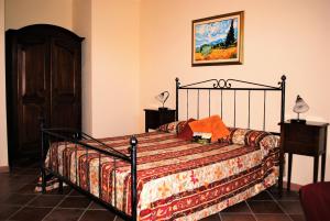 A bed or beds in a room at Rosso Di Sera