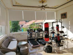 a living room with a glass table with some exercise equipment at Bungalow Sáng Tươi Mountains in Phu Quoc