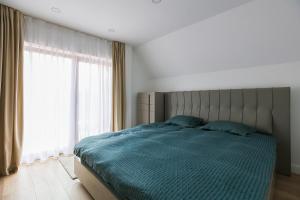 Ένα ή περισσότερα κρεβάτια σε δωμάτιο στο Mures Stay