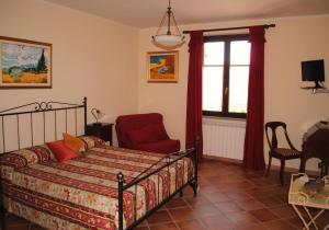 A bed or beds in a room at Rosso Di Sera