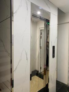 a elevator in a building with a marble wall at Wind House Hotel in Sa Pa