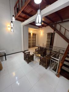 an empty room with tables and chairs in a building at Ella Bungalow in Ella