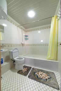 a bathroom with a toilet and a sink at Shokhname in Khiva