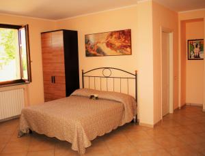 A bed or beds in a room at Rosso Di Sera