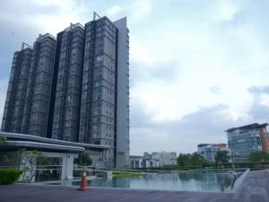 a group of tall buildings in a city at ImpianKU at HYVE SOHO Cyberjaya - Studio - Wifi in Cyberjaya