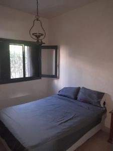 Ένα ή περισσότερα κρεβάτια σε δωμάτιο στο Cazona Villa Carmen2